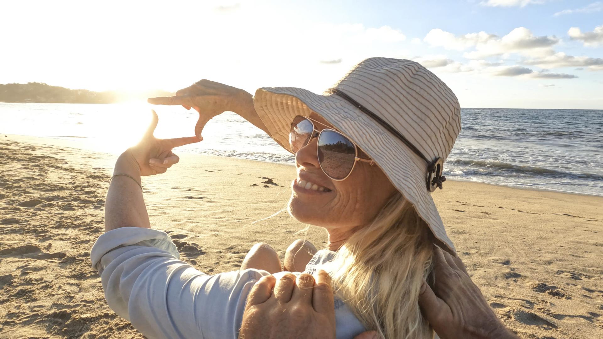 Woman in hat on the beach